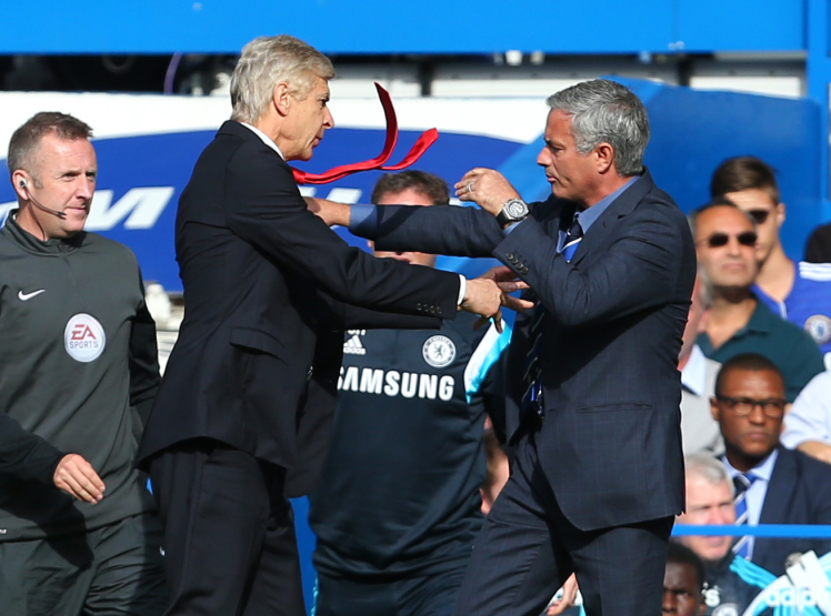 Arsene Wenger manager / head coach of Arsenal goes over to Jose Mourinho the head coach / manager of Chelsea and pushes him resulting in a scuffle between the two managers (Photo by AMA/Corbis via Getty Images)